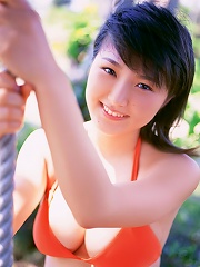 Short haired gravure idol with big boobs wearing a bikini